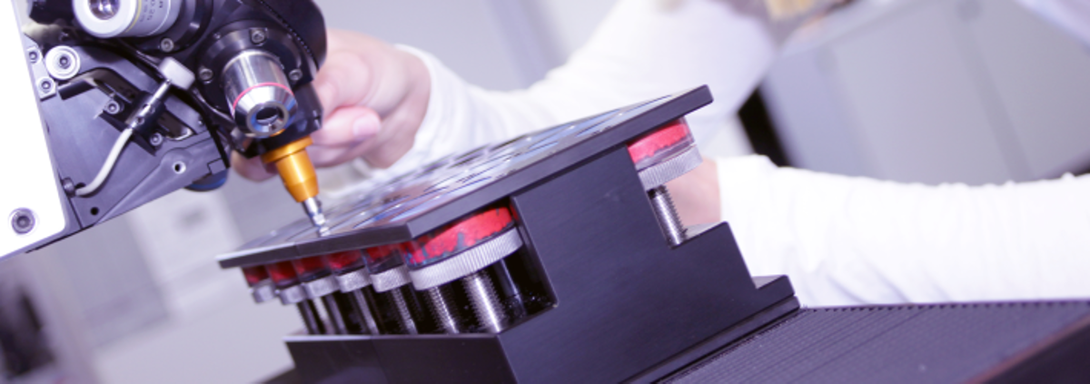 Employee Using a Hardness Tester Machine Employee Using a Hardness Tester Machine