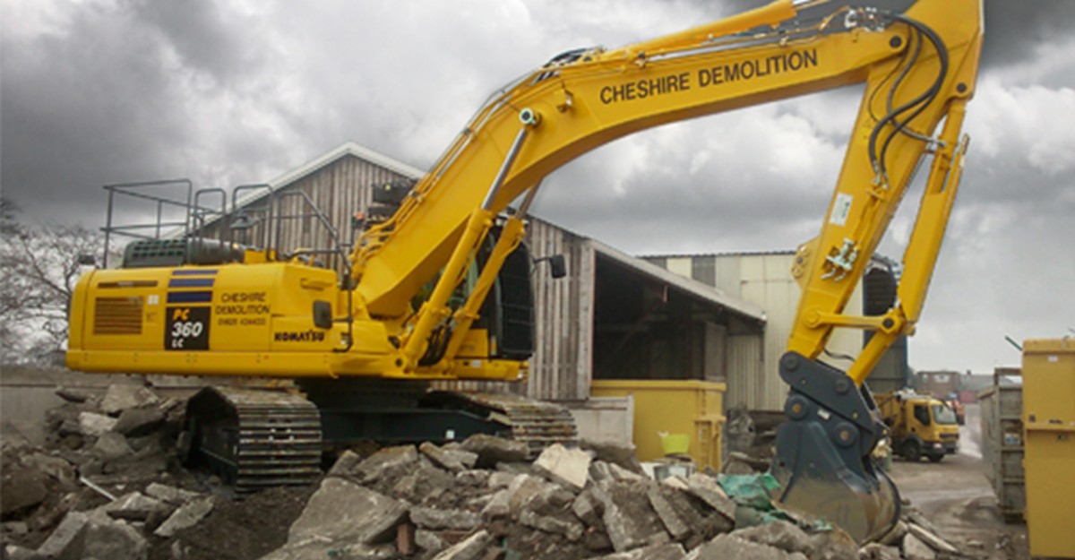 Yellow Excavator Digging Up Rocks