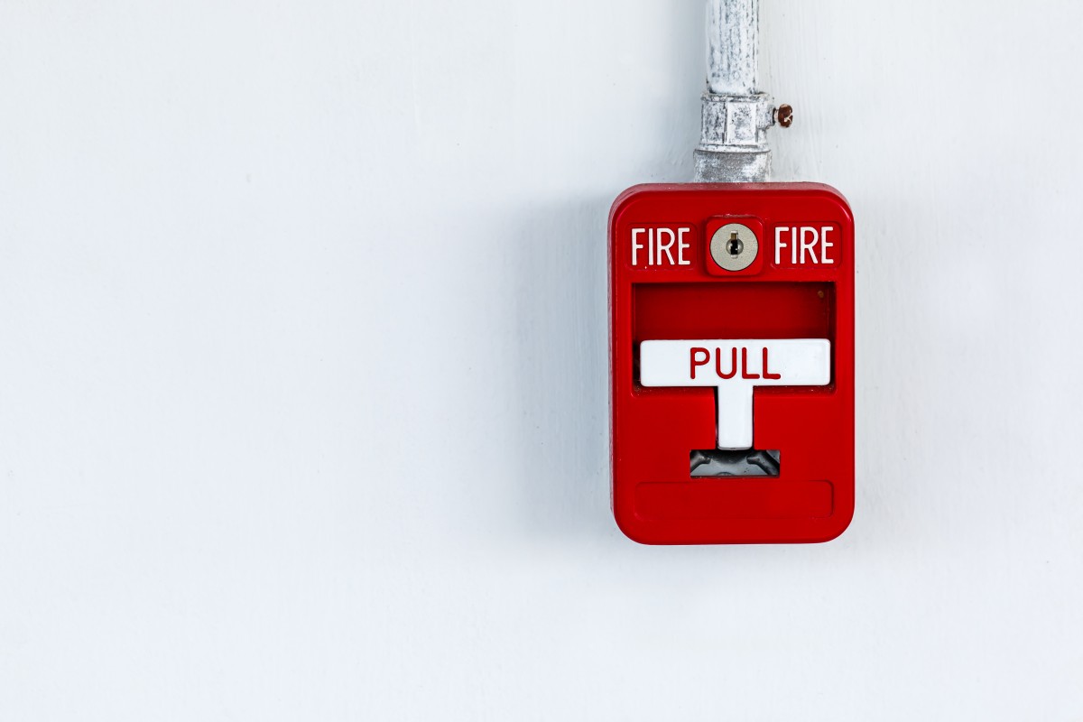 Red Fire Alarm on Wall Red Fire Alarm on Wall