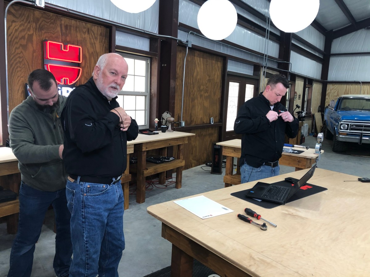 Randy and Aaron put their mics on before filming.
