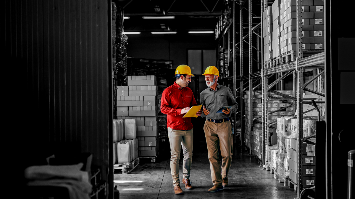 A Würth Account Manager speaking with a customer while walking through a warehouse